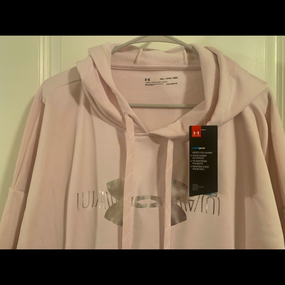 Light pink/rose gold Under Armour hoodie.